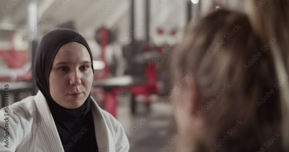 Muslim fighter speaking with trainer Muslim fighter speaking with trainer