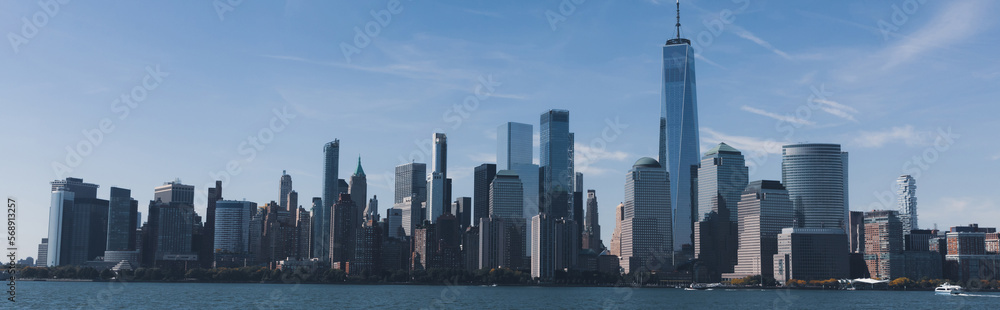 Fototapeta premium picturesque cityscape of Manhattan skyscrapers and Hudson river in New York City, banner.