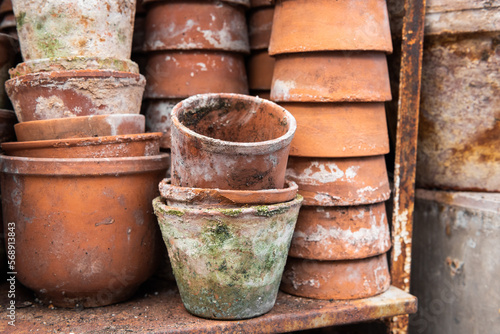Clay pots. Stacks of old pots. ceramic dishes for flowers. Flower stock. Used items for recycling or reuse.