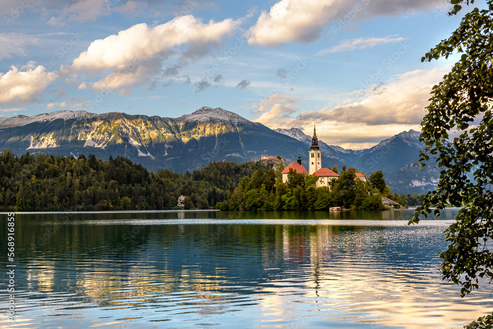 Fototapeta premium Church on island, lake and mountains background at Bled, Slovenia