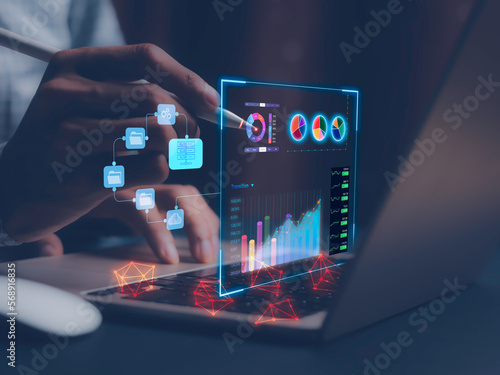 businessman working with business Analytics and Data Management System on computer, online document management and metrics connected to database. Corporate strategy for finance, operations, sales..