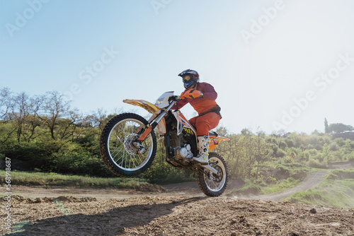 Man riding motorbike on motocross track.Extreme and Adrenaline. Motocross rider in action. Motocross sport. Active lifestyle