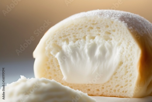  a close up of a piece of bread with a bite taken out of the end of it and a spoon in front of the bread. generative ai