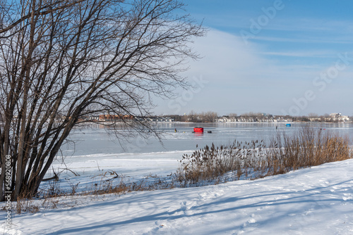 Ice Fishing On Fox River At De Pere, Wisconsin, In Early February photo