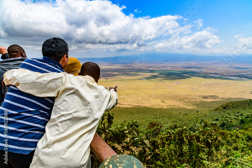 View of the Ngorongoro crater in Tanzania. Ngorongoro conservation area. African landscape. Guide showing something to tourists photo