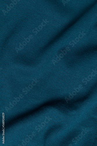 Crumpled blue textile. Full frame, top view.