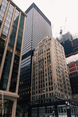 low angle view of concrete and glass buildings in midtown of New York City.