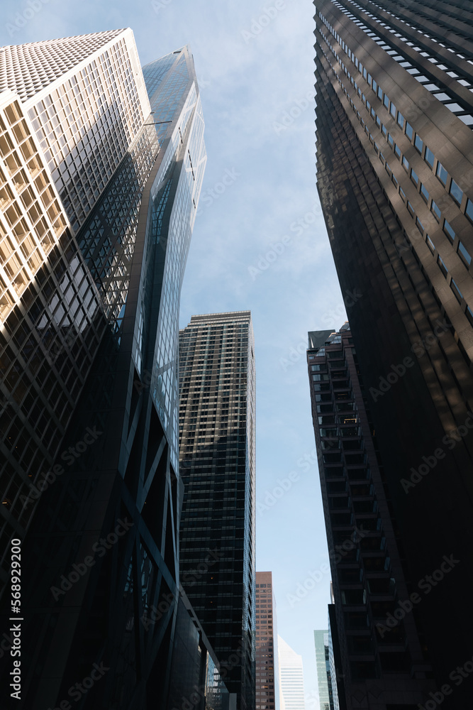 low angle view of facades of high-rise buildings in midtown of New York City.
