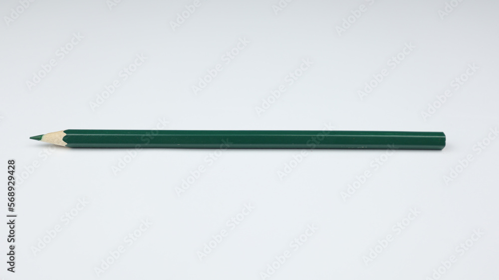 Pencil on a clean white background. Preparation for school. Dark green pencil Pencil on a clean white background. Preparation for school. Dark green pencil