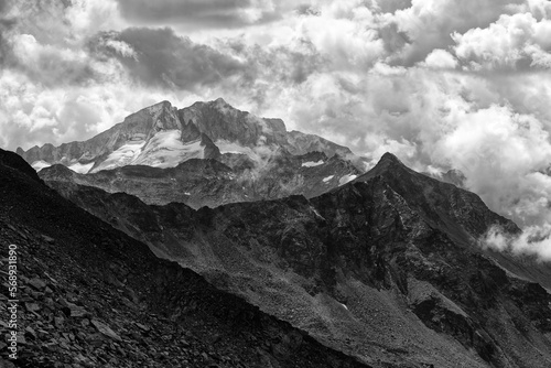 Dramatic view to the mountain peaks of Großelendkopf and Hochalmspitz with clouds, black and white photo, High Tauern National Park, Austrian Alps, Europe © si2016ab