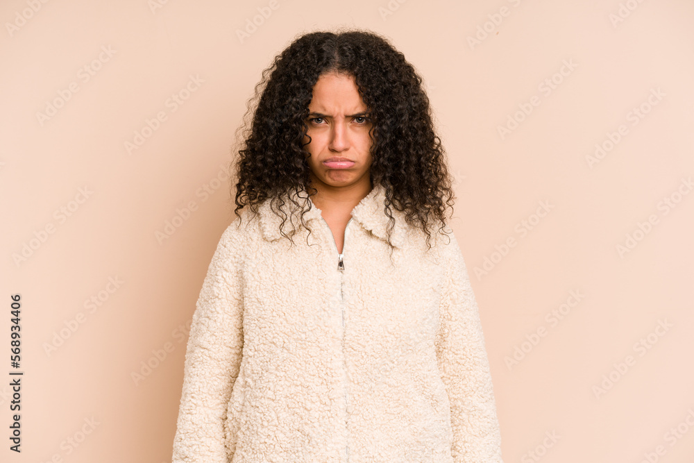 Young african american curly woman isolated sad, serious face, feeling miserable and displeased. Young african american curly woman isolated sad, serious face, feeling miserable and displeased.