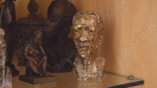 Black Stock Footage of historic African Art, Masks, Artifacts, and Sculptures in a home museum showcasing the diversity of African descendents, cultures, and creativity photo