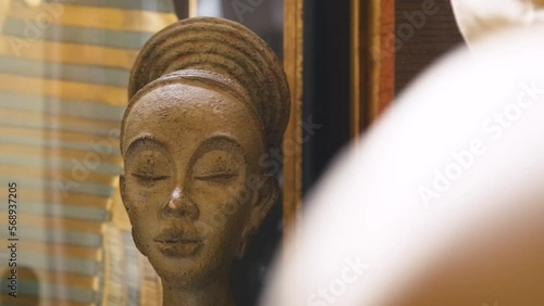 Black Stock Footage of historic African Art, Masks, Artifacts, and Sculptures in a home museum showcasing the diversity of African descendents, cultures, and creativity photo