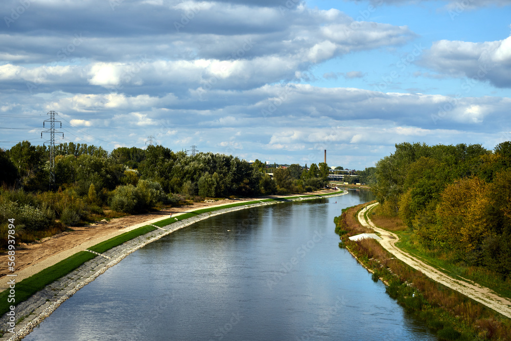 sandy road and trees on the river Warta in the city of Poznan