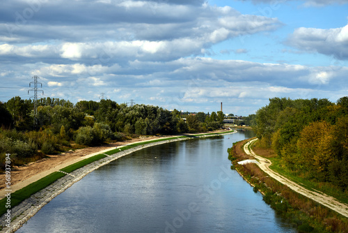 sandy road and trees on the river Warta in the city of Poznan
