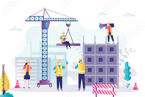 Construction site, tower crane builds a house. Building and construction process. Group of workers in uniform and engineers at a construction site. Teamwork.