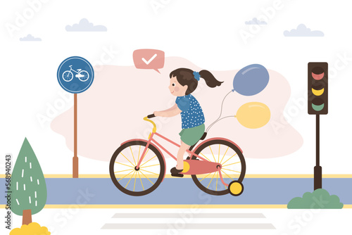 Caucasian girl rides bicycle on special separate track. Safe movement, eco-friendly and safe transport for little child. Fun time spending, sports. Cute kid cyclist. City road, urban landscape.
