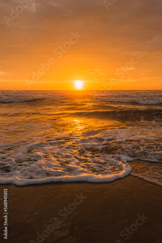 Sea sunrise with beautiful cloudscape over the beach