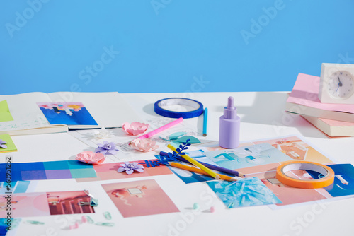 Artist workspace with reference ideas and palette for new product photo