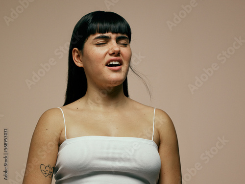 Woman about to sneeze photo