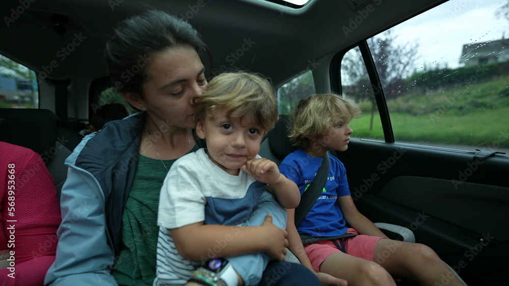 Kids in car back seat mother and child inside vehicle transportation Kids in car back seat mother and child inside vehicle transportation