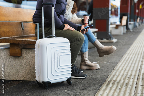 Travel suitcase in train station photo