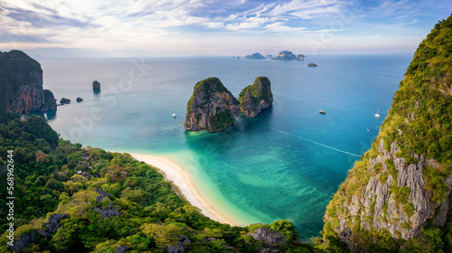 Aerial view through the lush jungle of Krabi of the beautiful Phra Nang Cave Beach without people, Thailand © moofushi