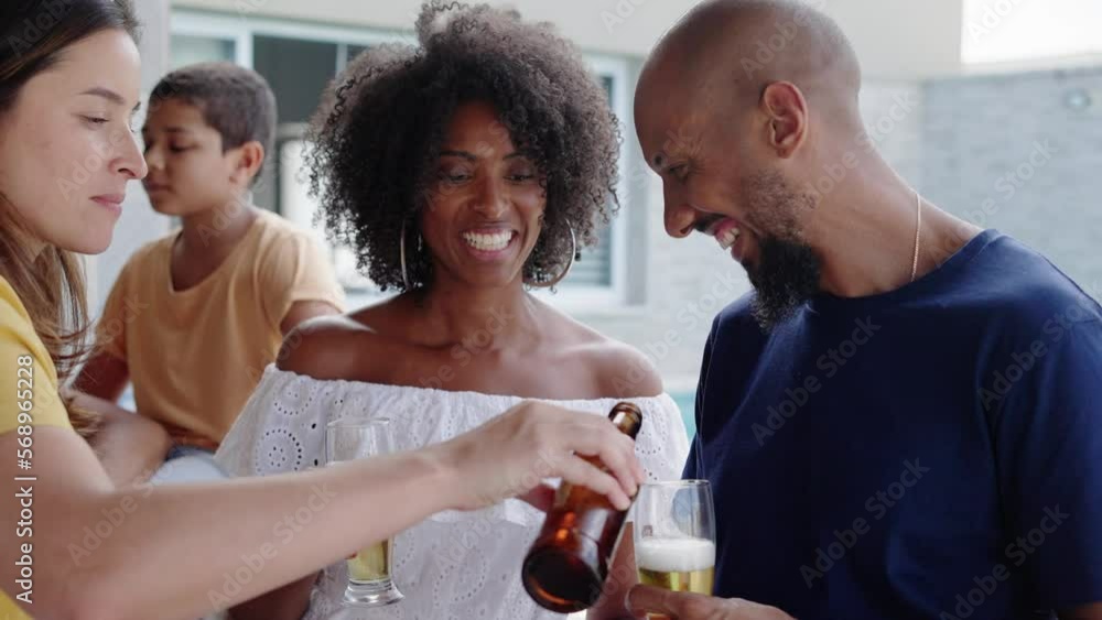 Happy friends gathering and eating in a traditional brazilian barbecue. Drinking beer. Happy friends gathering and eating in a traditional brazilian barbecue. Drinking beer.