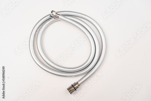 New flexible rubber shower hose on a white background. 