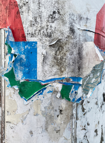 wall with torn posters