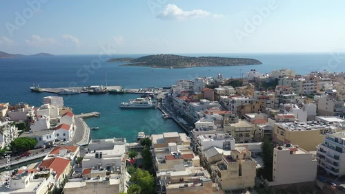 Aerial view of Agios Nikolaos, a picturesque coastal town with colorful buildings around the port in the eastern part of the island Crete, Greece