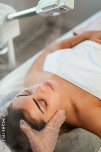 Beauty treatment with ozone facial steamer photo