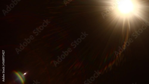 Easy to add lens flare effects for overlay designs or screen blending mode to make high-quality images. Abstract sun burst, digital flare, iridescent glare over black background.