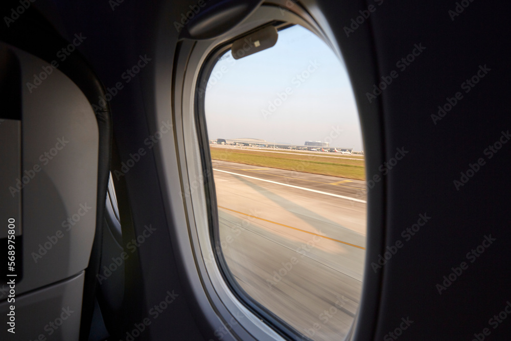 Close up airplane window, view of about to take off Close up airplane window, view of about to take off