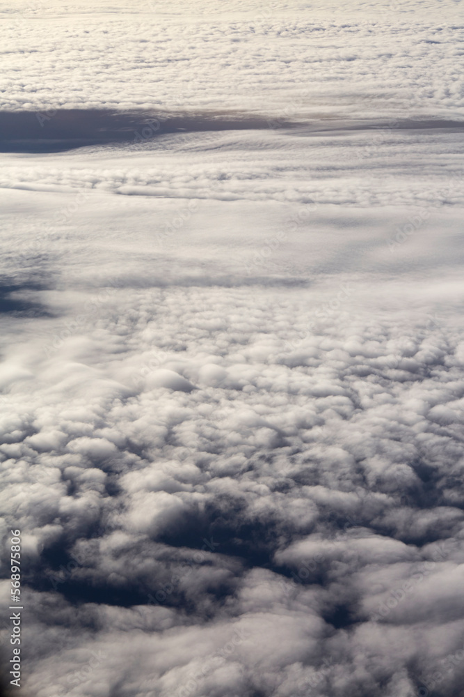 Closeup ethereal dreamy clouds, thousands of miles high in the sky Closeup ethereal dreamy clouds, thousands of miles high in the sky