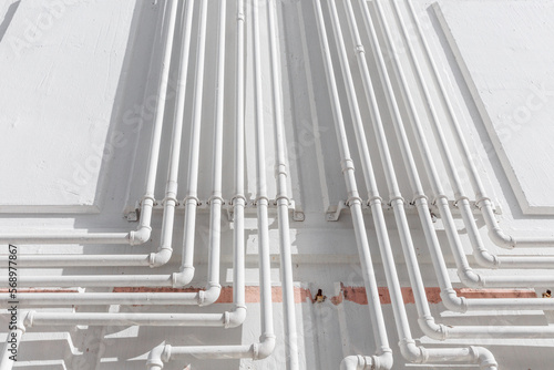 Multiple gas pipes and shadows.