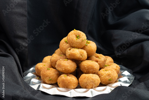 Indian Mithai Balushahi Also Called Balsaahi, Badushah, Khurmi, Glazed Doughnuts Made Of All Purpose Plain White Flour Maida, Desi Ghee, Claified Butter Drenched Soaked in Cheeni Ki Chasni Sugar Syrup