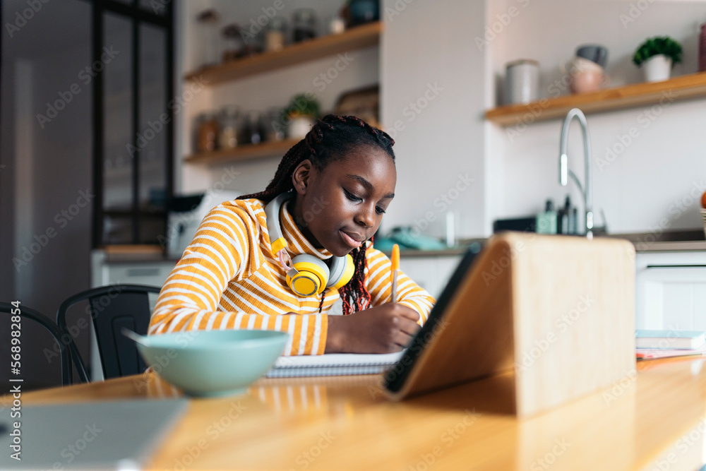 Young student doing homework. Young student doing homework.