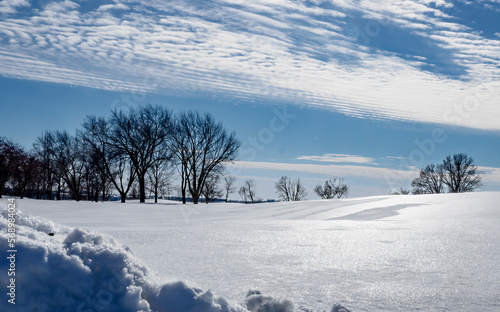 Ice covered snow on a blue sky day