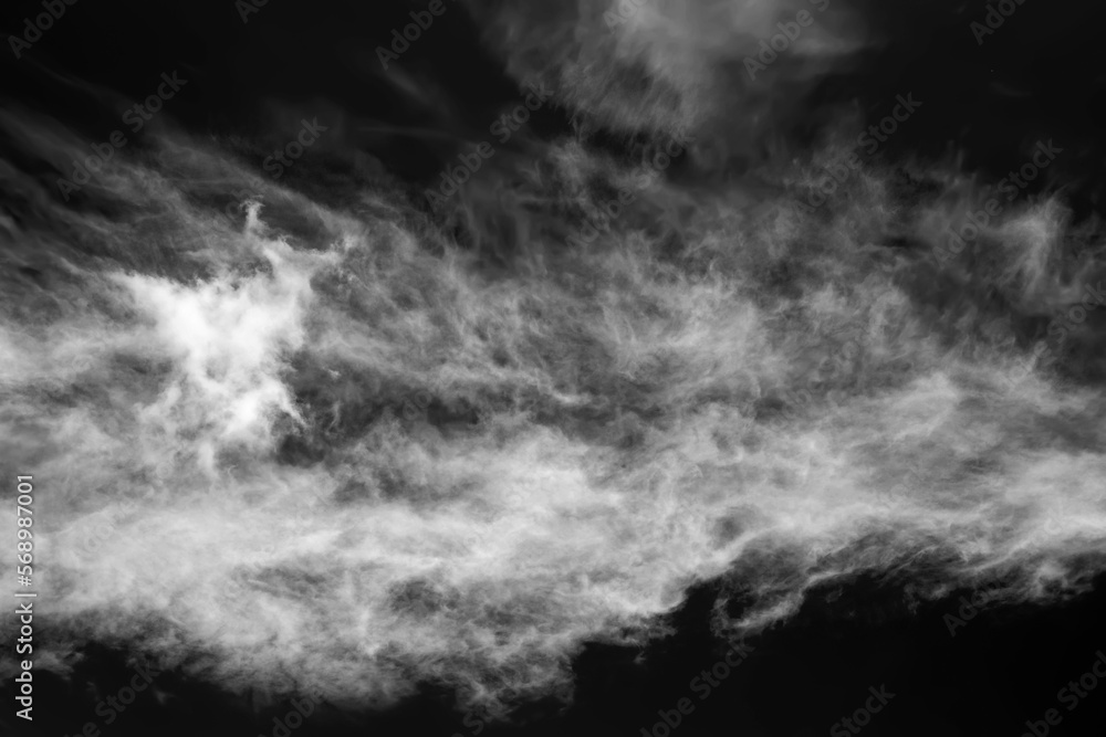 White clouds on a dark dramatic sky. Black and white sky template