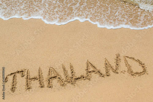 Thailand written in a sandy