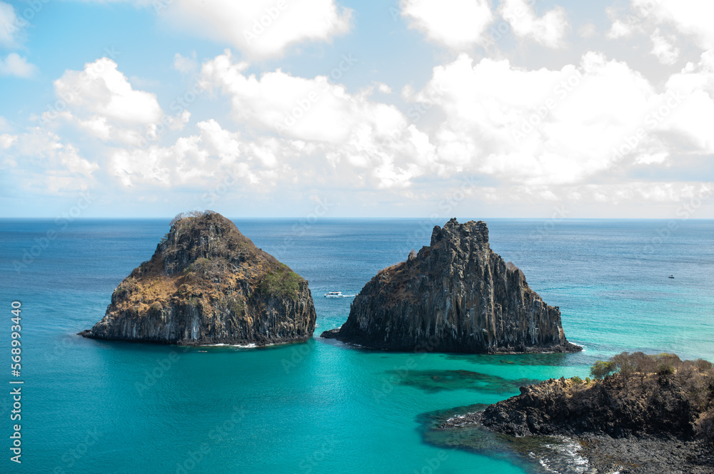 A beautiful sunny day in fernando de noronha, with a breathtaking view from the belvedere of Praia do Sancho overlooking the bay of pigs and Morro dos Dois Irmãos with crystal clear waters.