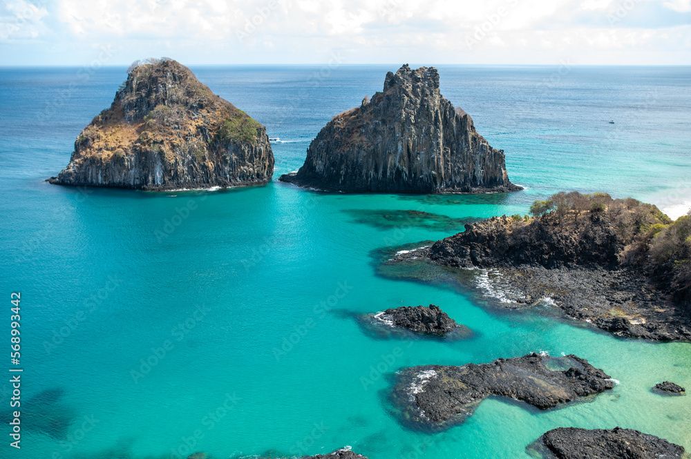 A beautiful sunny day in fernando de noronha, with a breathtaking view from the belvedere of Praia do Sancho overlooking the bay of pigs and Morro dos Dois Irmãos with crystal clear waters.