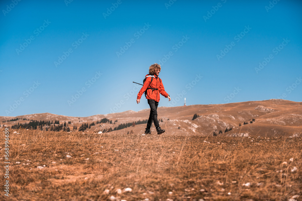 A mountaineer enjoys walking and exploring mountain areas