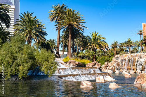 Waterfall and pond with palm trees next to the Mirage Hotel and Casino on the Strip in Las Vegas  Nevada.