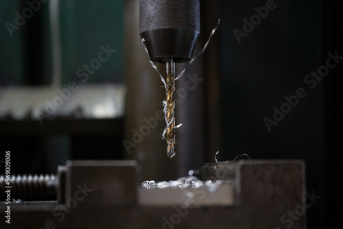 Part machining with drilling machine