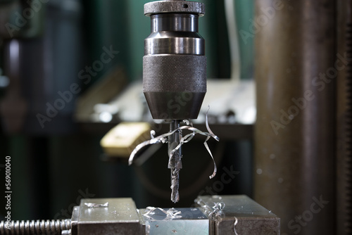 Part machining with drilling machine