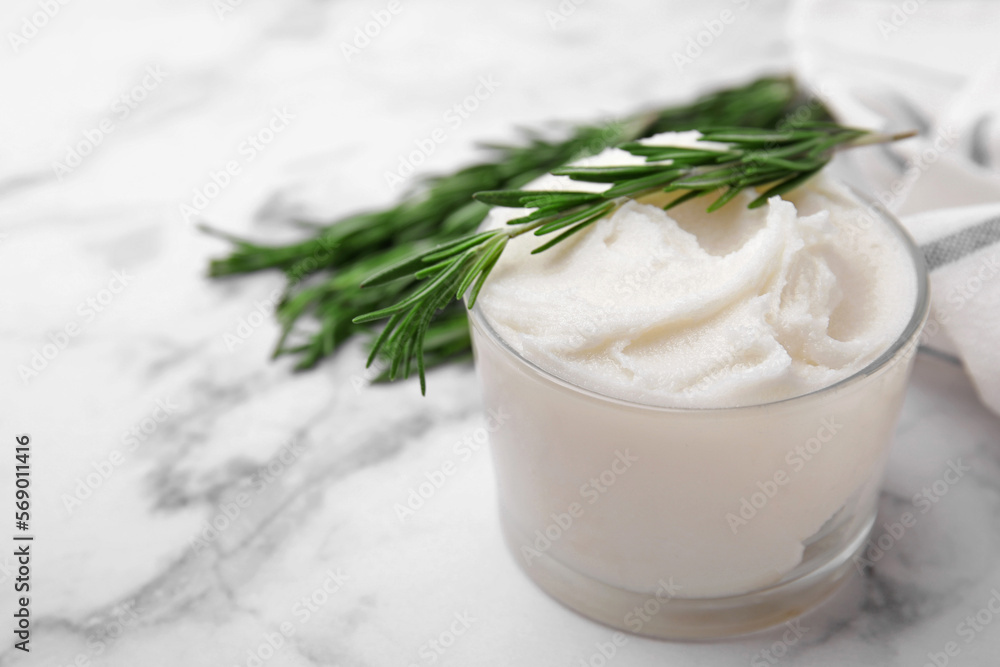 Delicious pork lard with rosemary in glass on white marble table, closeup Delicious pork lard with rosemary in glass on white marble table, closeup