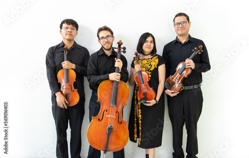 Tableau sur toile multiethnic group of musicians, string quartet posing for camera not playing