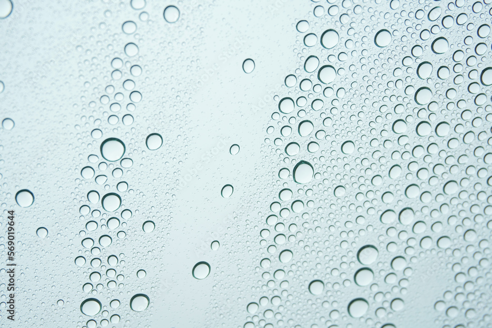 close up view of window glass with water drops close up view of window glass with water drops